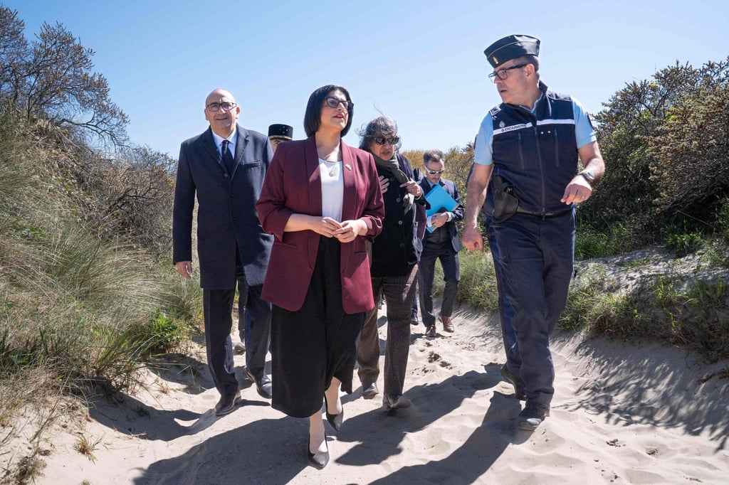 British Home Secretary Shabana Mahmood (centre) walks with French Interior Minister Laurent Nunez (left) and French police officers as they attend a presentation of operational resources used to combat illegal immigration, on Zuydcoote beach, near Dunkirk, northern France, April 23. Photo: AFP
