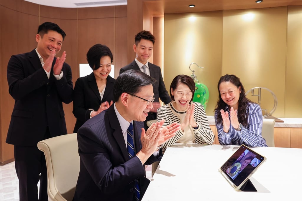 John Tse (far left) joins Chief Executive John Lee in calling Vivian Kong to congratulate her on winning Hong Kong’s first gold medal at the Paris Olympics. Photo: Handout