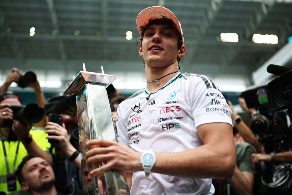 Kimi Antonelli celebrating with his trophy after winning his third race in a row. Photo: AFP