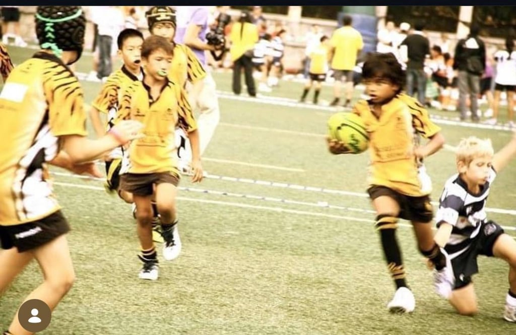 Young Shiven Dukhande (right) playing for the Tigers team, where he developed his passion for rugby. Photo: Booklet