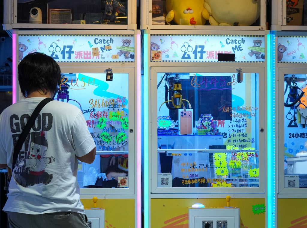 A man tries his luck at a claw machine shop in Causeway Bay. Photo: Jelly Tse