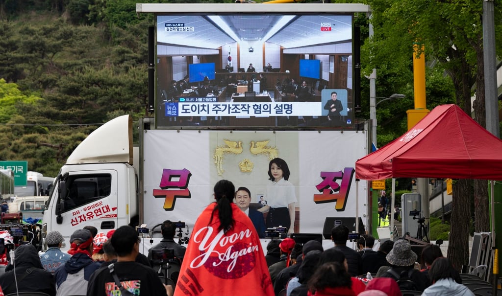 Supporters of former first lady Kim Keon-hee watch live broadcast of her trial as they rally outside Seoul High Court on April 28. Photo: EPA