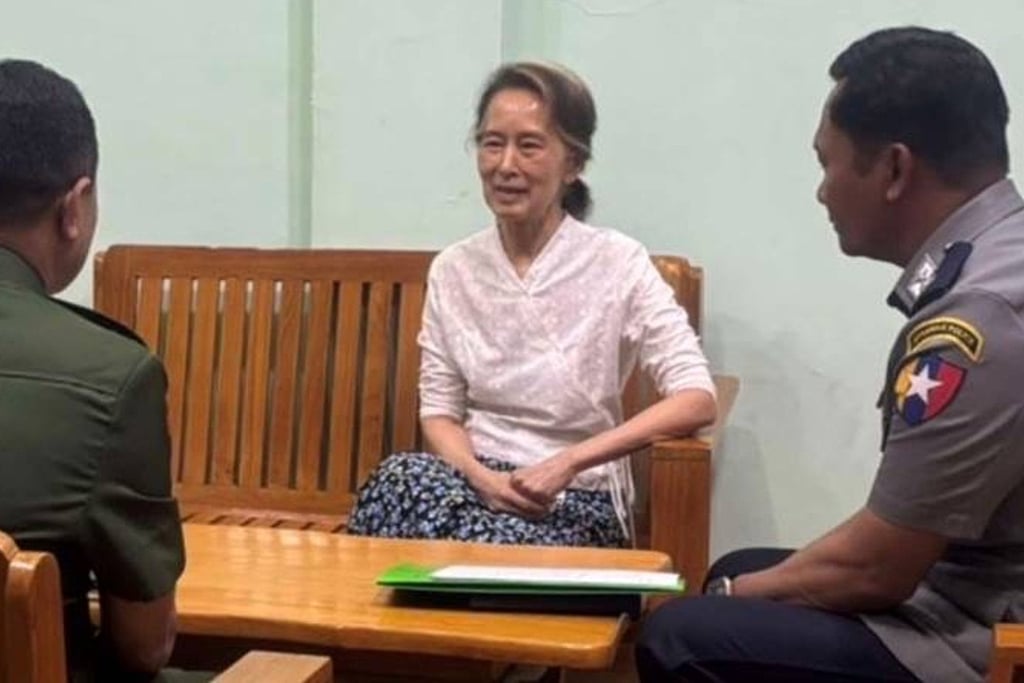 Myanmar’s former leader Aung San Suu Kyi is seen talking to officials in a photo provided by the military on Thursday. Photo: Myanmar Military True News Information Team/AP