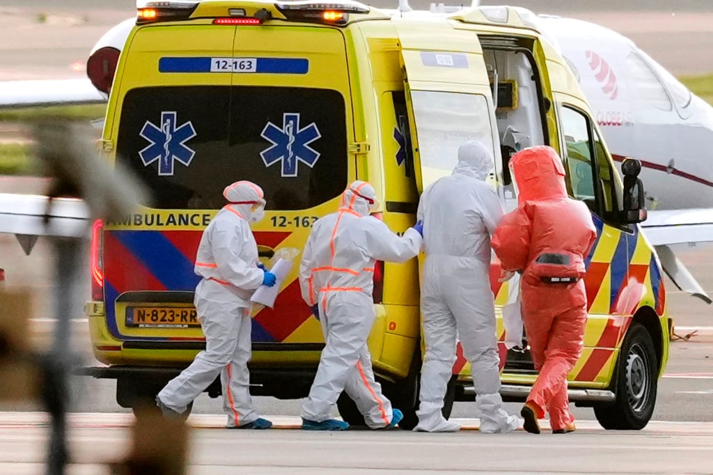 Medical staff escort a patient (second right) who was evacuated from the MV Hondius and flown to Schiphol airport in Amsterdam on Wednesday. Photo: AP
