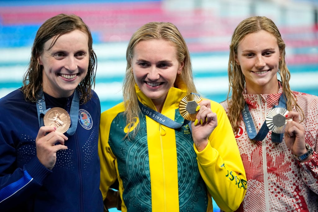 Ariarne Titmus with her 2024 Olympics 400m freestyle gold alongside bronze medallist Katie Ledecky of the US and Canadian silver medallist Summer McIntosh. Photo: AP Photo