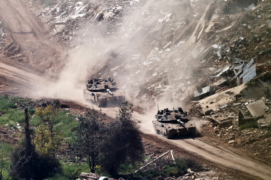 Israeli troops manoeuvre on the Lebanese side of the border on Friday. Photo: EPA