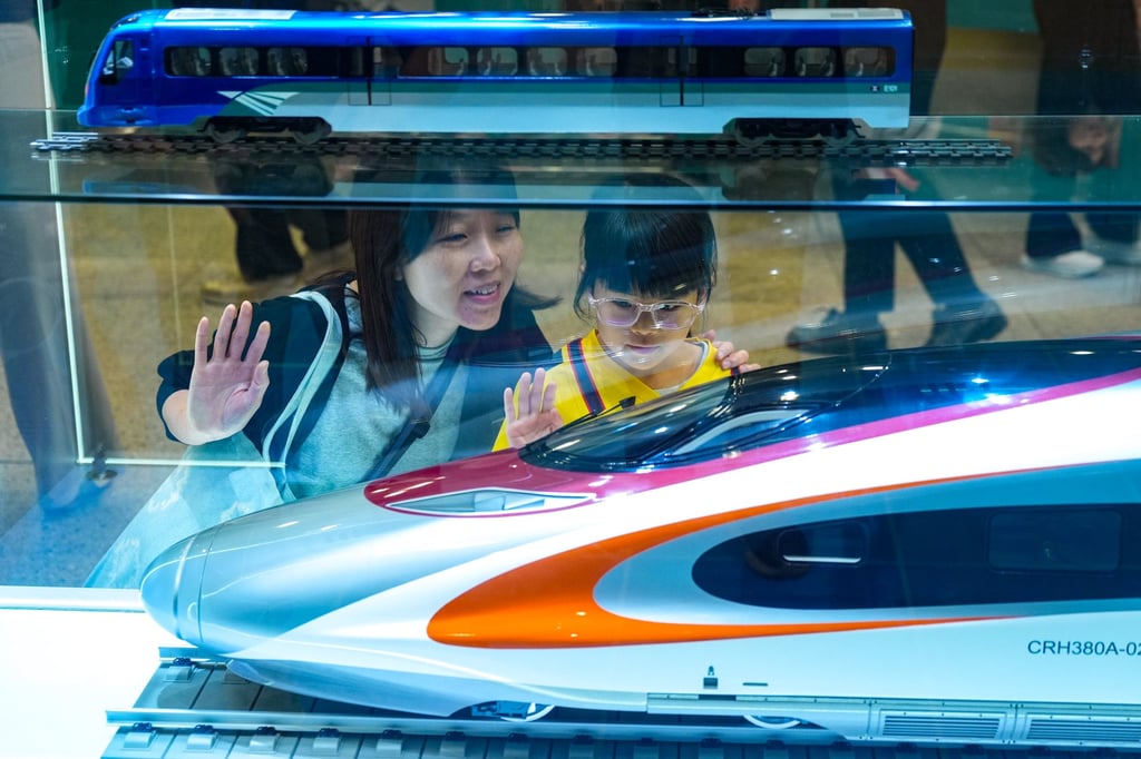Visitors admire a train model at the exhibition preview at Hung Hom station. Photo: Eugene Lee