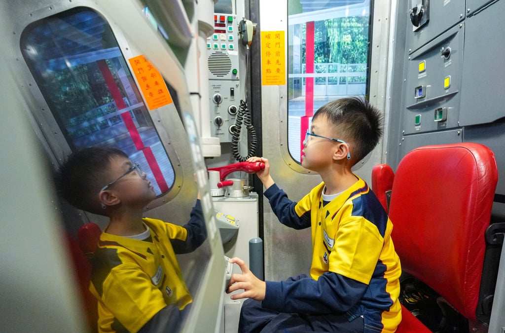A child tries his hand at the driving simulator. Photo: Eugene Lee