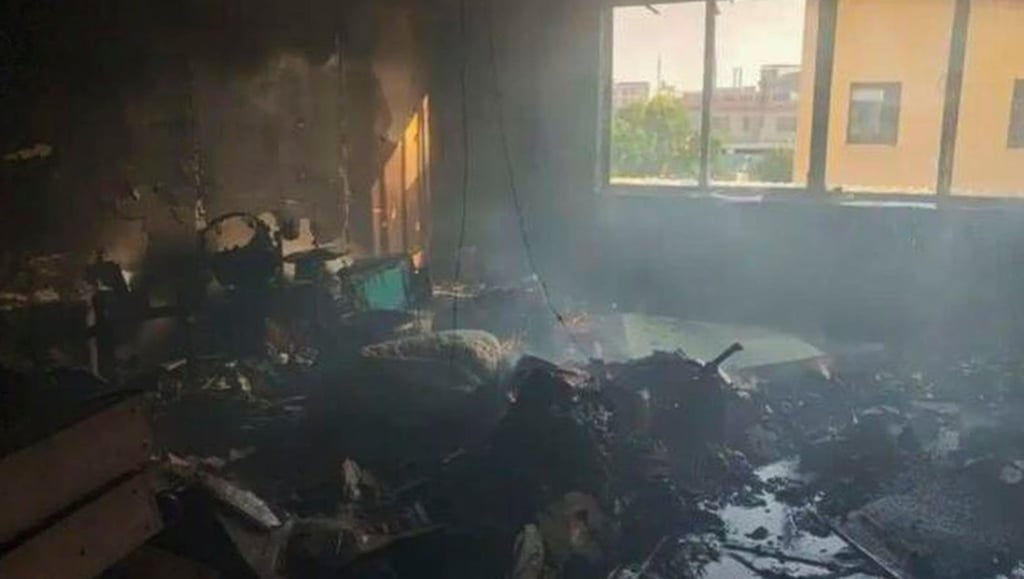 The charred remains of the office, above, which was destroyed in the blaze. Photo: Weibo