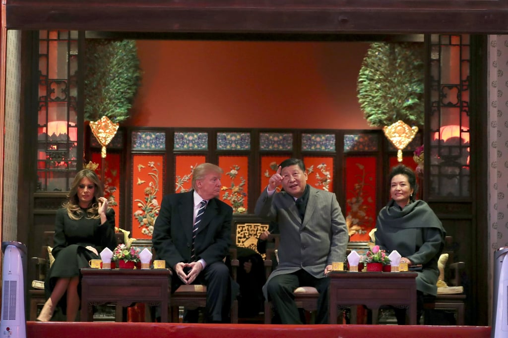 The two presidents and their wives tour the Forbidden City during the high-profile visit. Photo: AP