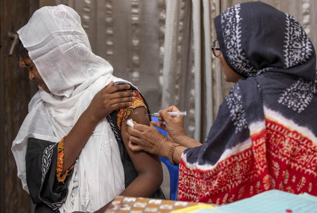 Family welfare officer Tahmina administers a birth control injection to a woman at the Savar Upazila Health Complex in Dhaka on April 27. Photo: AFP