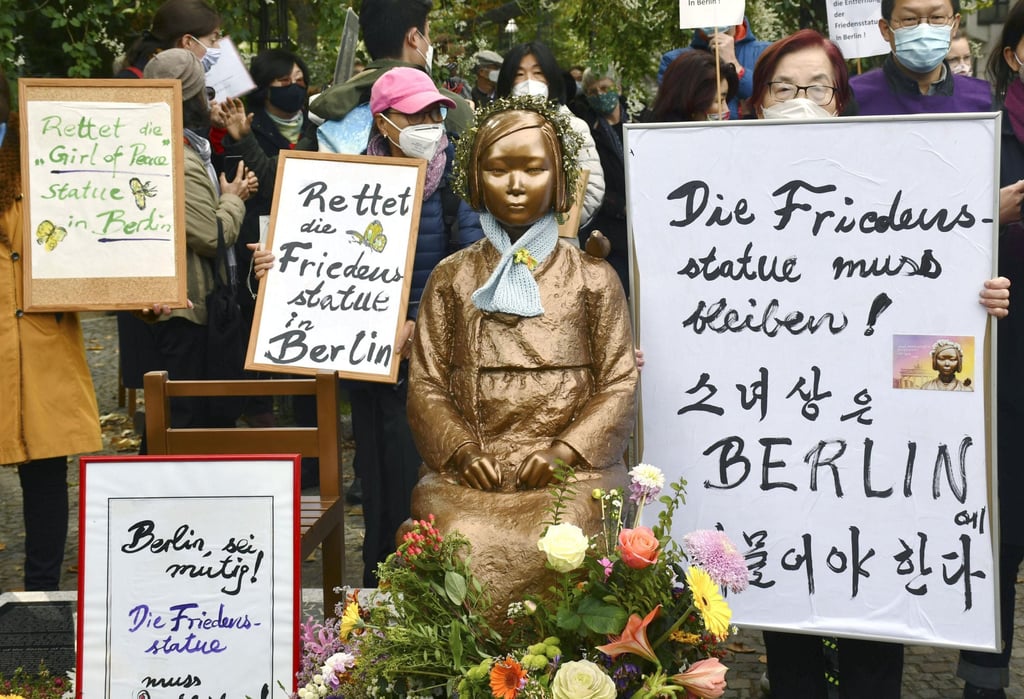 Activists gather around a statue in central Berlin symbolising a Korean “comfort woman” in 2020. Photo: Kyodo