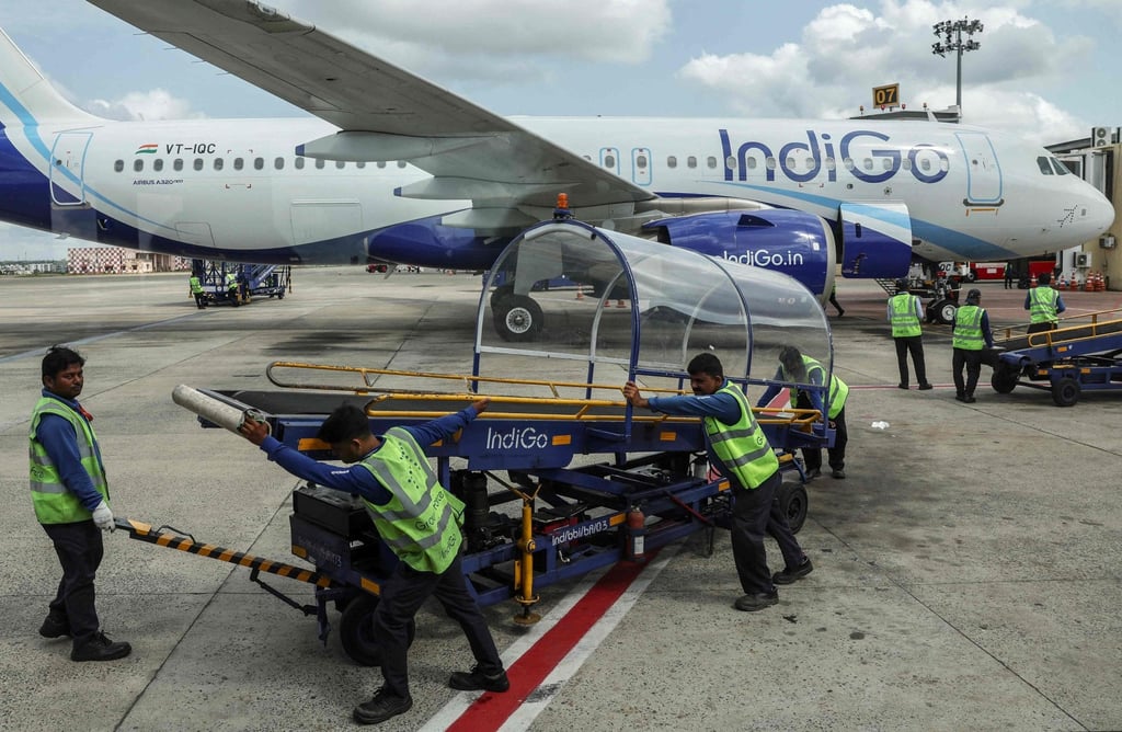 Ground staff members prepare an IndiGo Airlines plane for take-off at Biju Patnaik International Airport in Bhubaneswar on May 8. Photo: AFP Ground staff members prepare an IndiGo Airlines plane for take-off at Biju Patnaik International Airport in Bhubaneswar on May 8. Photo: AFP