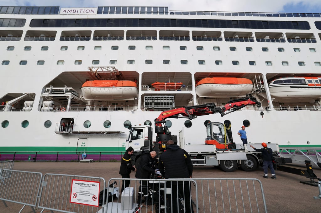 Harbour security members work in front of the cruise ship Ambition in Bordeaux, France, on Wednesday. Photo: Reuters
