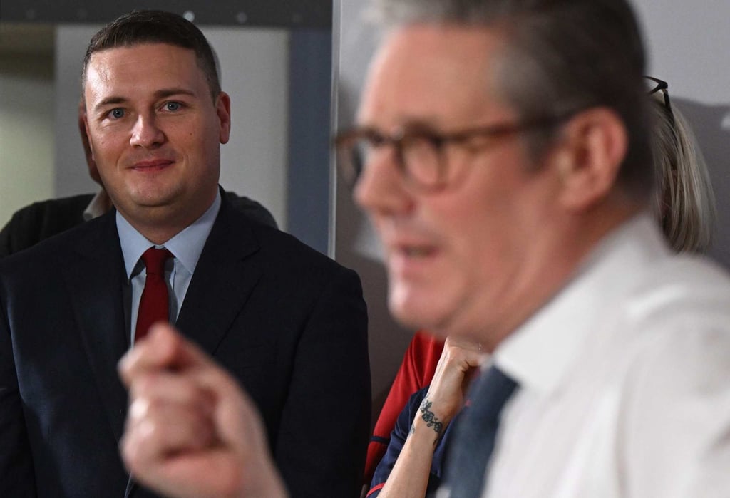 Britain’s Health Secretary Wes Streeting (left) listens as Prime Minister Keir Starmer delivers a speech in Epsom, southwest of London last year. Photo: AFP