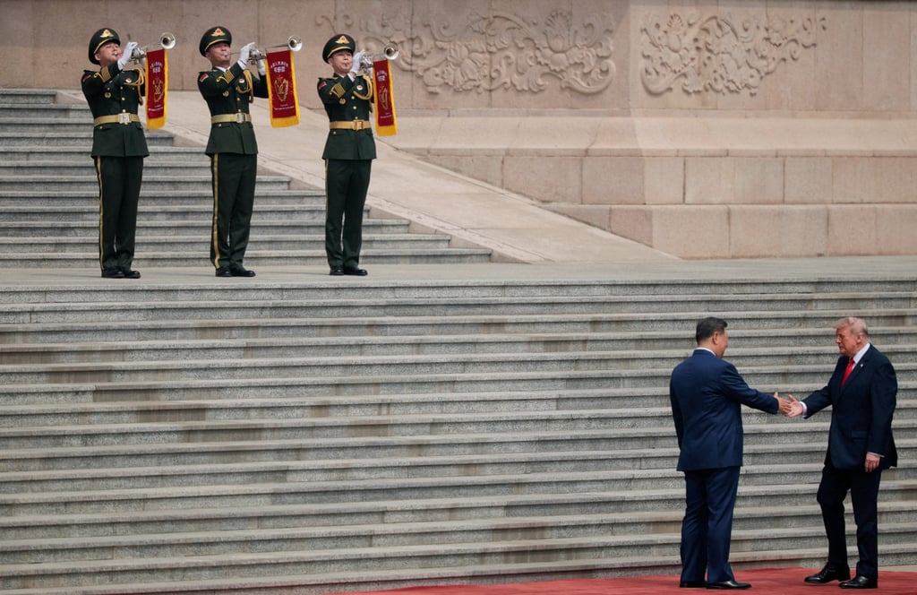 US President Donald Trump shakes hands with Chinese President Xi Jinping upon arrival at the Great Hall of the People in Beijing on Thursday. Photo: Reuters