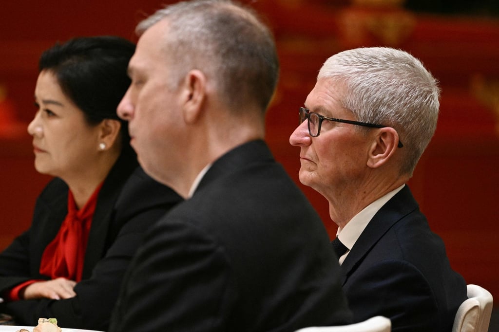 Zhou Qunfei (left) sits next to Apple CEO Tim Cook at a state banquet for US President Donald Trump at the Great Hall of the People in Beijing on May 14, 2026. Photo: AFP