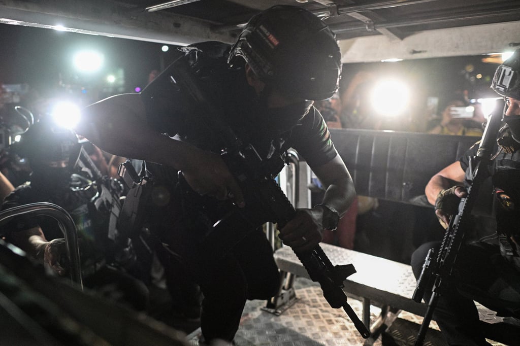 Armed Swat team members board a vehicle en route to the Philippine Senate on Wednesday. Photo: Reuters