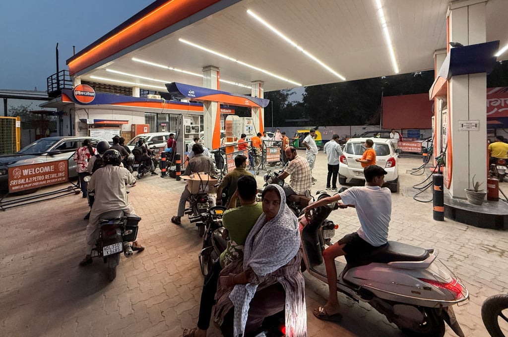 Motorists queue to fill refuel in their vehicles at a station in New Delhi on Wednesday. Photo: Reuters