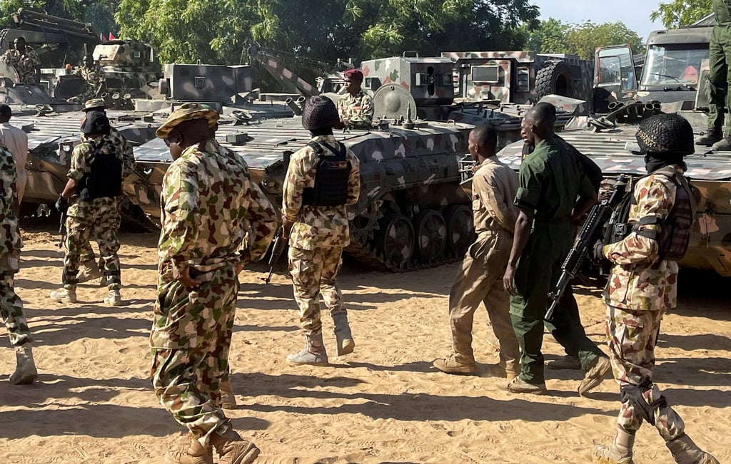 Nigerian soldiers walk past military tanks prepared for deployment in Maiduguri, Borno, on November 7, 2025. Photo: Reuters