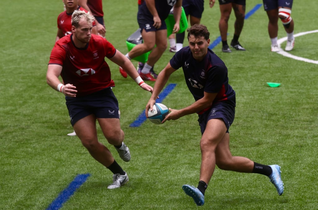Matteo Avitabile (right) makes a pass as Jack Bartlett shadows him. Photo: Jonathan Wong