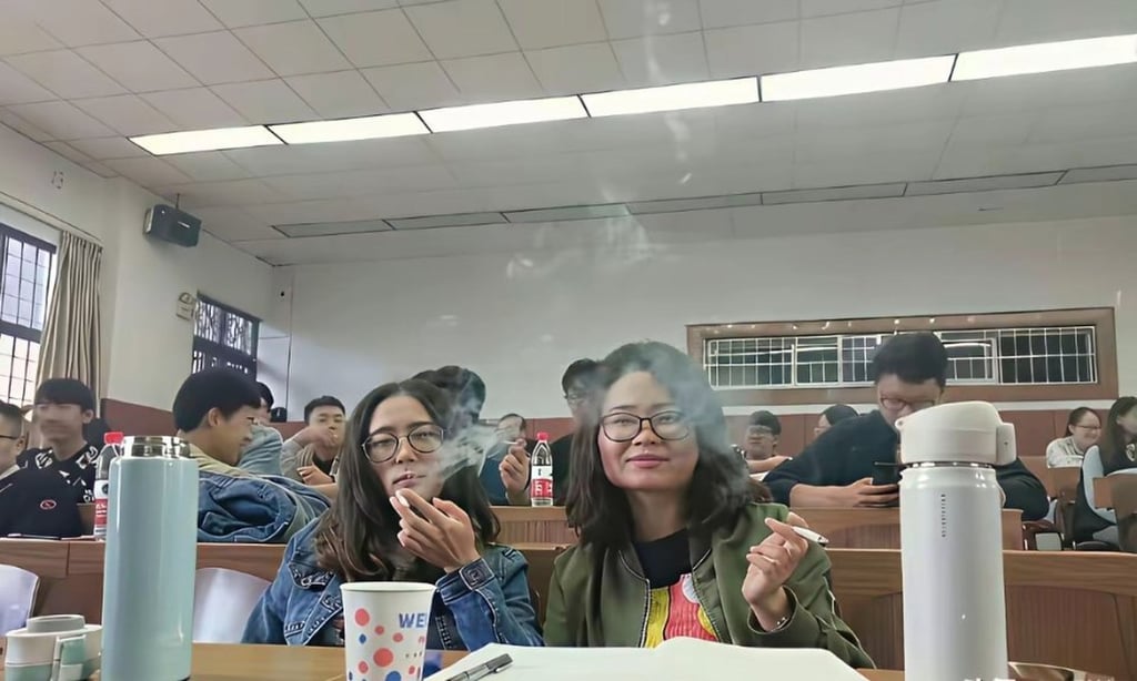 Two female students enjoy a cigarette in a campus smoking area. Photo: Handout Two female students enjoy a cigarette in a campus smoking area. Photo: Handout