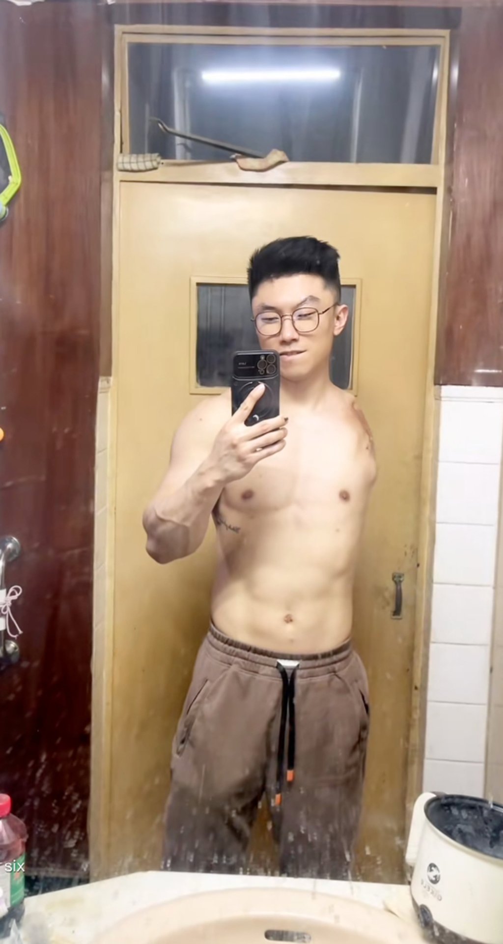 Disabled former athlete, Liu Xinju, above, takes a photograph of himself in a mirror. Photo: Douyin