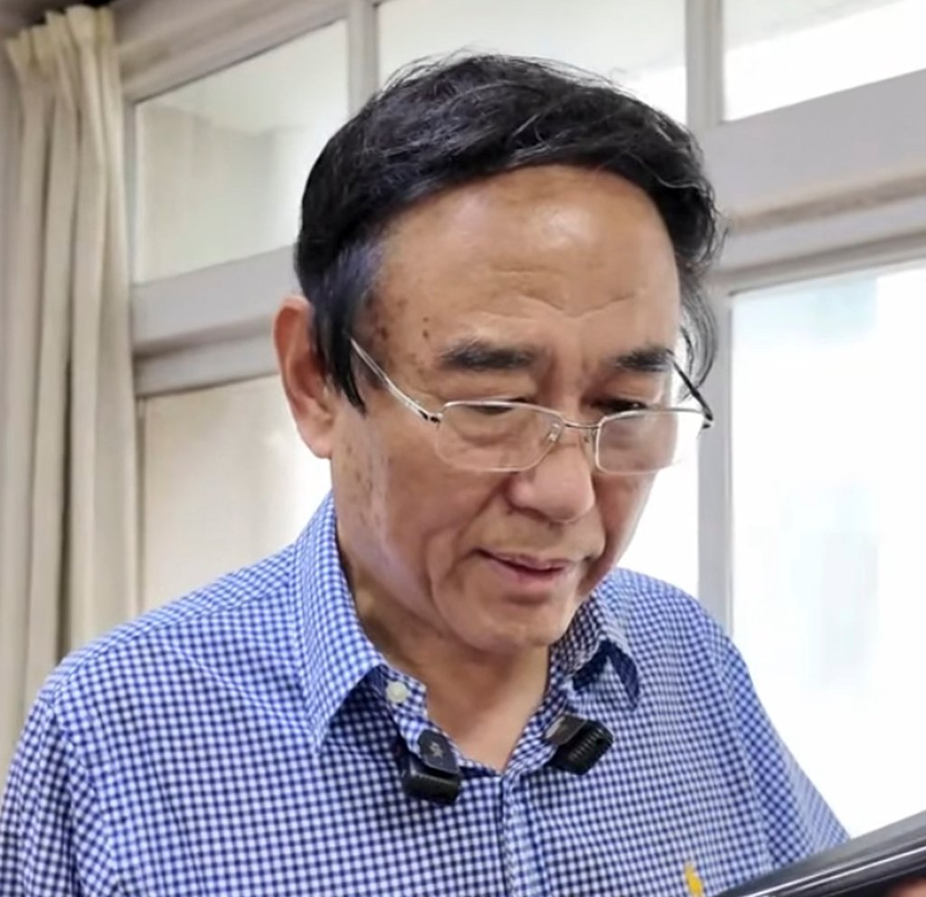 School vice-principal Bai Fan, above, just before he called Sakolsky to make the invitation. Photo: Sina School vice-principal Bai Fan, above, just before he called Sakolsky to make the invitation. Photo: Sina