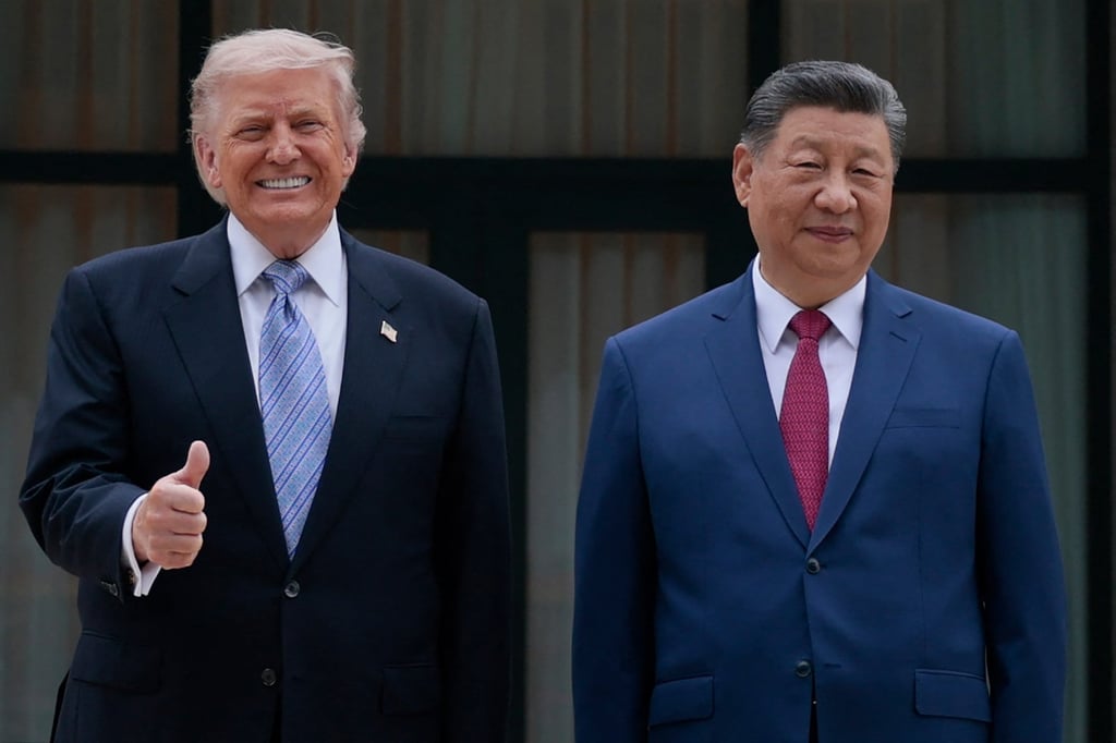 US President Donald Trump poses for photos with President Xi Jinping on Friday in Beijing. Photo: AFP
