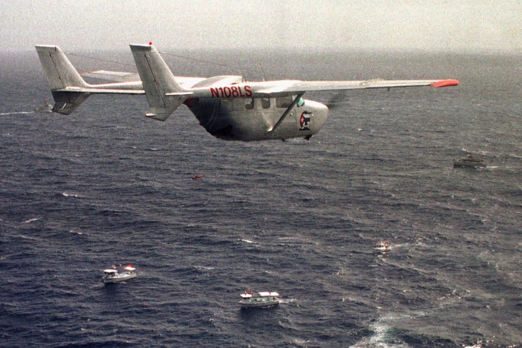 A Brothers to the Rescue plane flies over The Democracy Movement flotilla at the ‘12-mile limit’ north of Havana, Cuba, July 10, 1999. Photo: AP A Brothers to the Rescue plane flies over The Democracy Movement flotilla at the ‘12-mile limit’ north of Havana, Cuba, July 10, 1999. Photo: AP