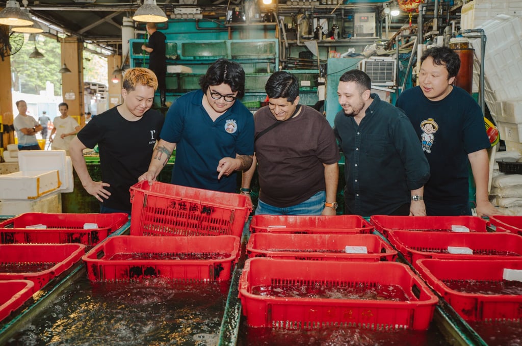On the Aberdeen Wholesale Fish Market tour are (from left) Leung Chun-wah, executive chef and co-owner of Racines; Gabe Chan, seafood buyer and sales marketing executive at Peter Seafood; Manav Tuli, chef-owner of Leela; Paolo Olivieri, founder and executive chef of Dieci; and Peter Kam, owner and director of Peter Seafood. Photo: Alexander Mak