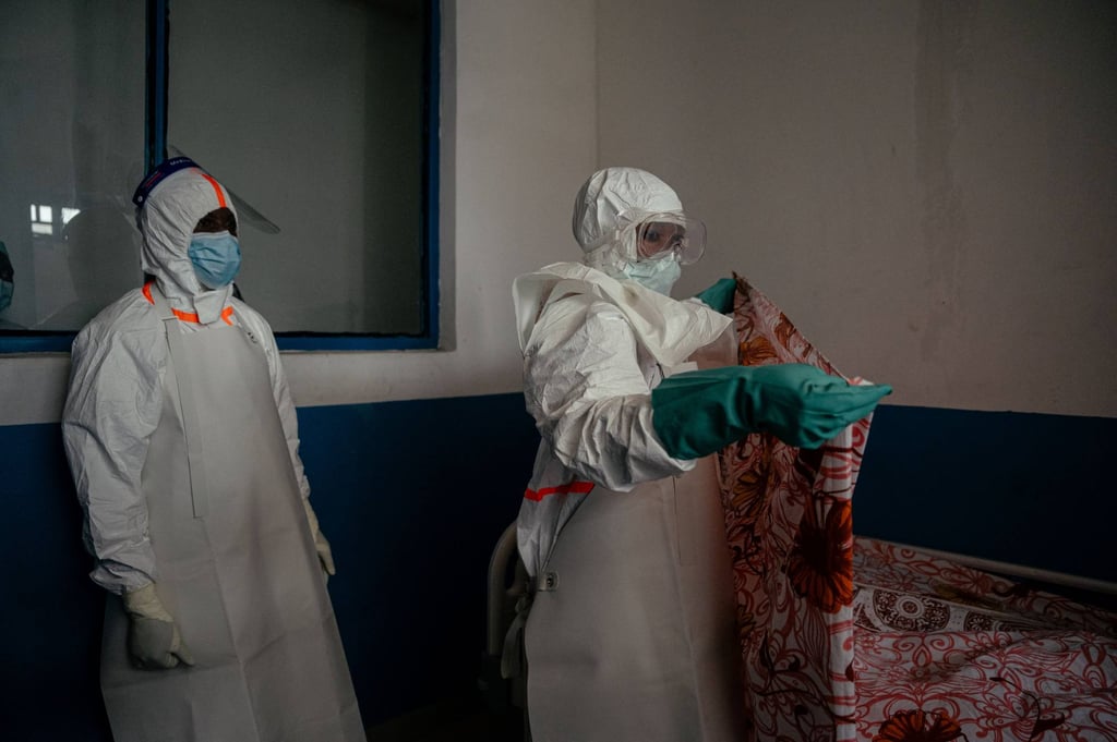 Medical personnel at CBCA Virunga Hospital in the DRC wearing protective gear on Thursday as they prepare an isolation room for a patient. Photo: AFP
