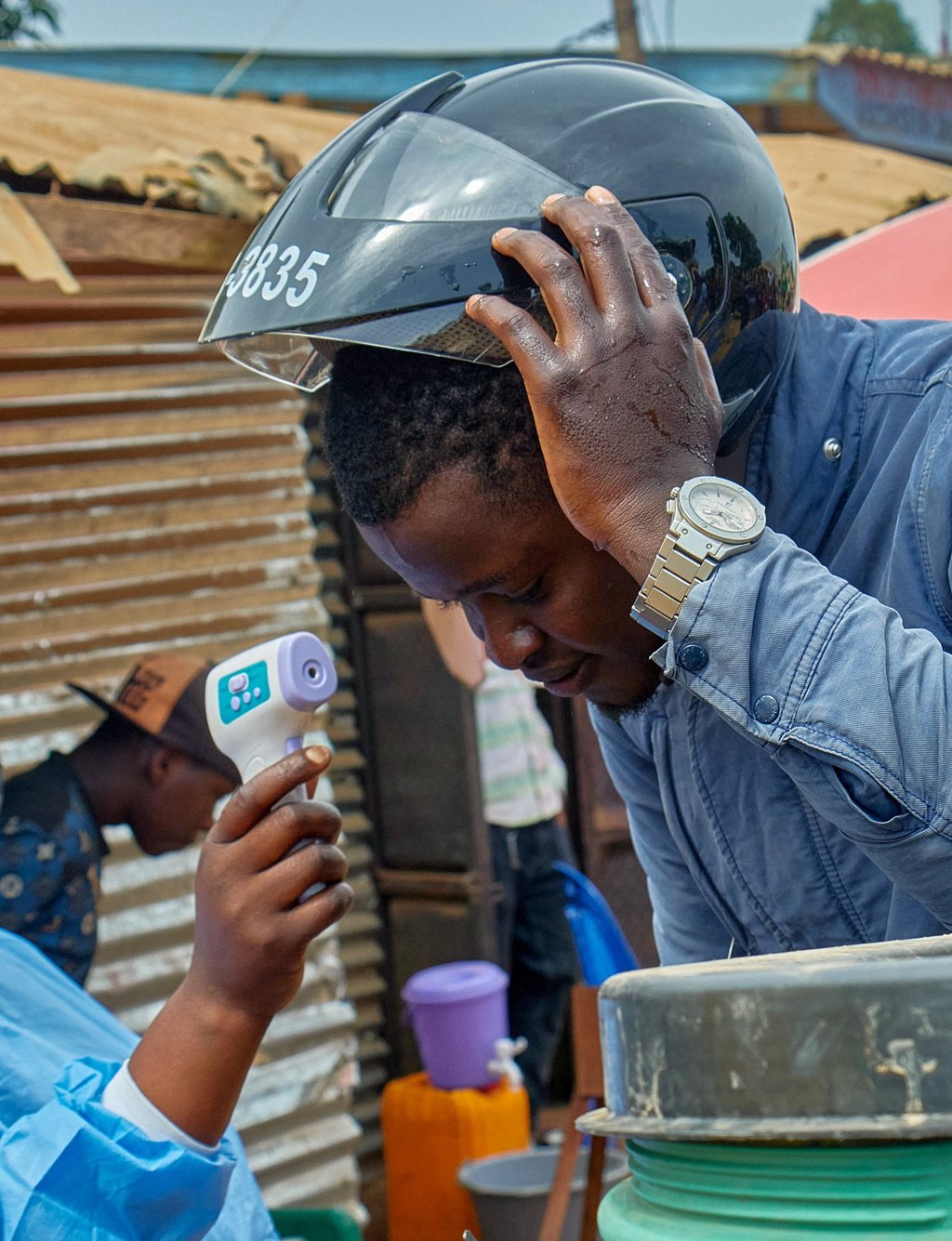 A motorcyclist in the DRC has his temperature taken on Saturday by a health worker at a checkpoint. Photo: Reuters A motorcyclist in the DRC has his temperature taken on Saturday by a health worker at a checkpoint. Photo: Reuters