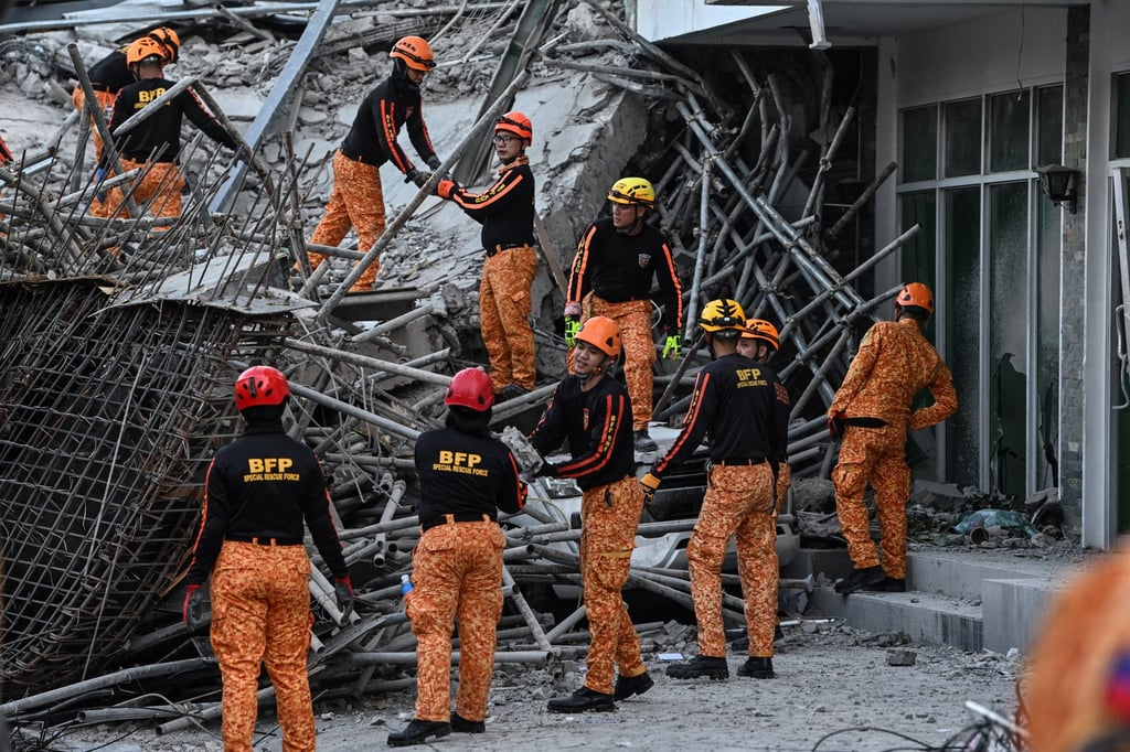 Rescuers move debris as they search for trapped survivors following the collapse of a nine-storey building under construction in Balibago, Angeles City, Pampanga, Philippines, on Sunday. Photo: Reuters Rescuers move debris as they search for trapped survivors following the collapse of a nine-storey building under construction in Balibago, Angeles City, Pampanga, Philippines, on Sunday. Photo: Reuters