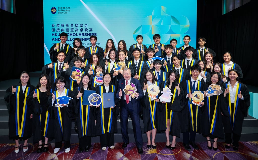 The Hong Kong Jockey Club CEO Winfried Engelbrecht-Bresges (centre) with JC Scholars.