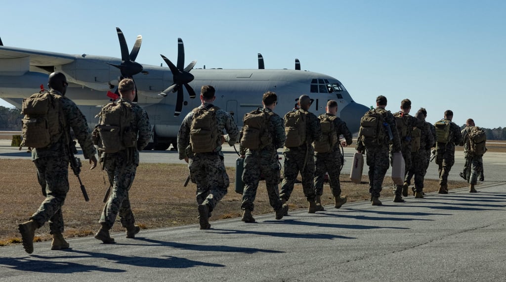 US Marines walk towards a C-130 Hercules plane at Marine Corps Air Station New River in Jacksonville in February 2025. Photo: US Marine Corps/Reuters