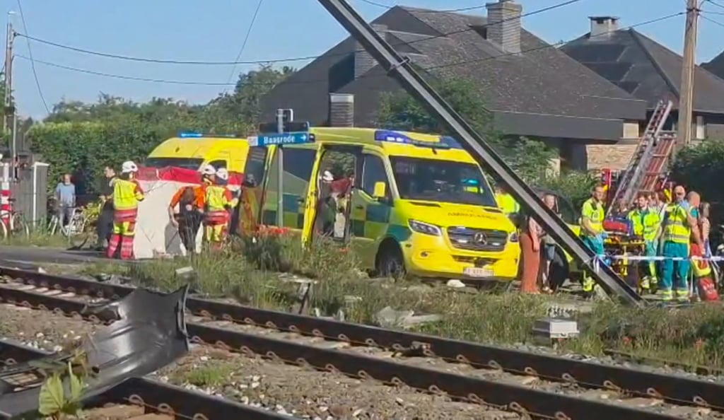 Rescuers set up a tent at the scene of the crash in Buggenhout on Tuesday. Photo: VTM/AP Rescuers set up a tent at the scene of the crash in Buggenhout on Tuesday. Photo: VTM/AP