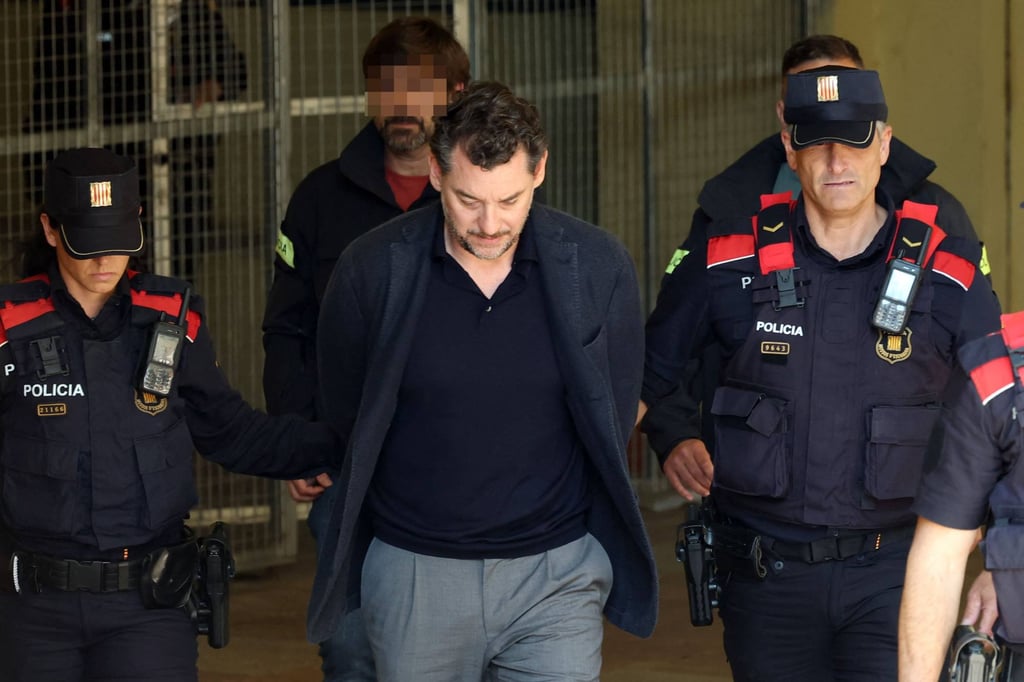 Catalan regional police officers escort Jonathan Andic as he arrives at a court in Martorell, near Barcelona, Spain, following his arrest on May 19. Photo: AFP Catalan regional police officers escort Jonathan Andic as he arrives at a court in Martorell, near Barcelona, Spain, following his arrest on May 19. Photo: AFP