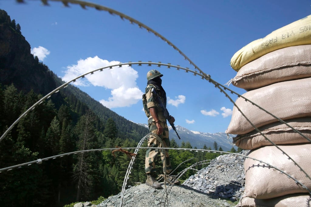 An Indian paramilitary soldier stands guard at check point along a road leading to Ladakh, near the disputed Line of Actual Control. Photo: EPA-EFE