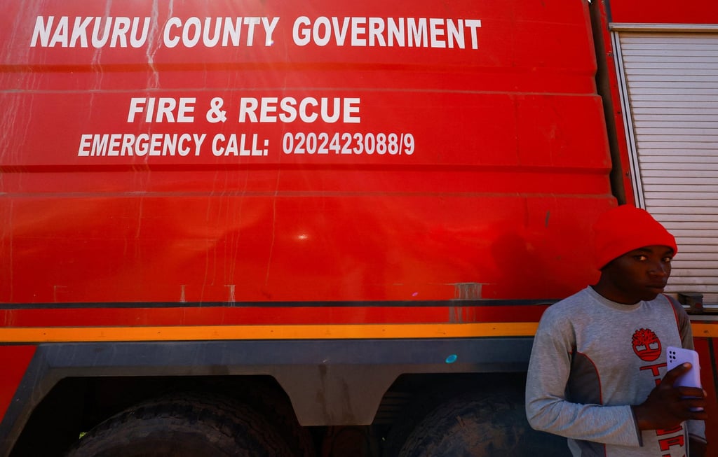 A man stands next to a fire engine at the Utumishi Girls’ Academy Senior School in Kenya on Thursday after an overnight fire. Photo: Reuters A man stands next to a fire engine at the Utumishi Girls’ Academy Senior School in Kenya on Thursday after an overnight fire. Photo: Reuters