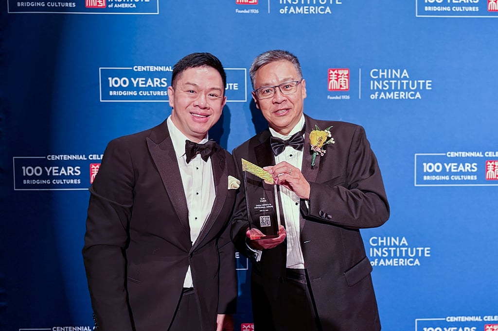 Andy Tung (right) shows off the award he received on behalf of his father with James Chau, president of the China-United States Exchange Foundation. Photo: CUSEF Andy Tung (right) shows off the award he received on behalf of his father with James Chau, president of the China-United States Exchange Foundation. Photo: CUSEF