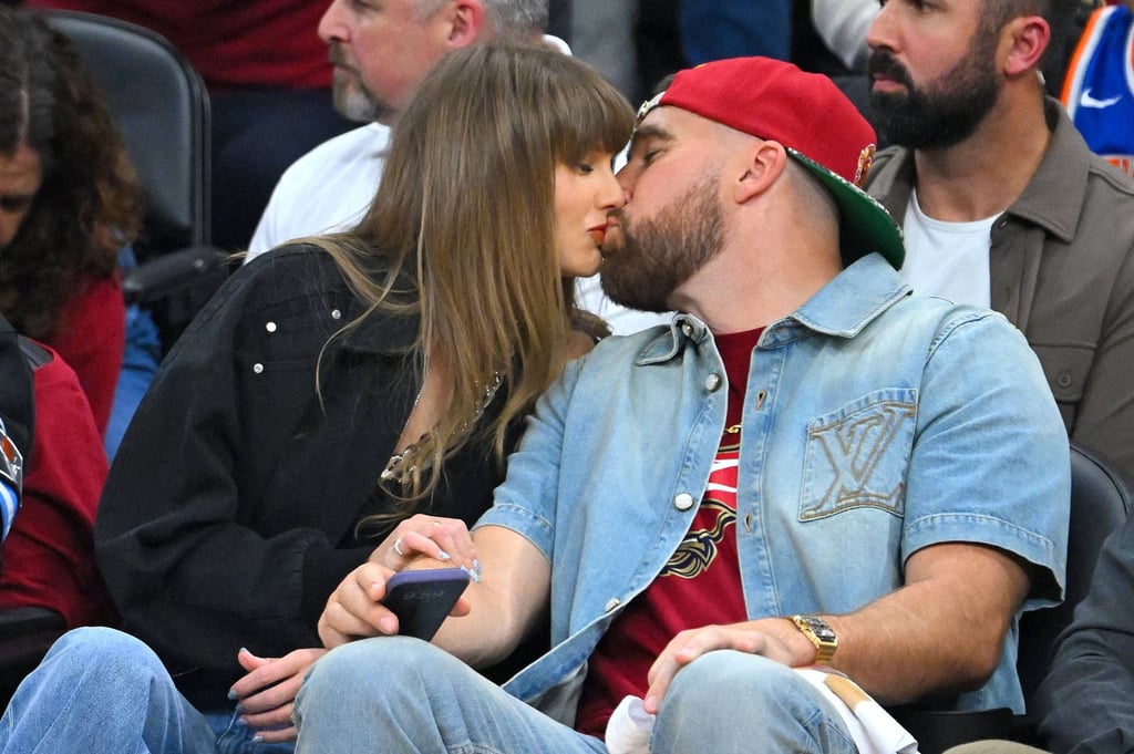 Taylor Swift and Travis Kelce kiss during a game between the New York Knicks and Cleveland Cavaliers this month. Photo: Getty Images via AFP