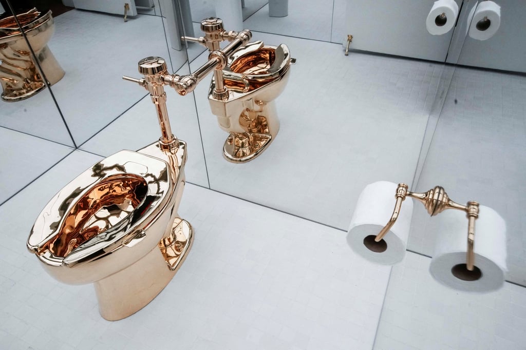 Maurizio Cattelan’s ‘America’, a fully functional gold toilet. Photo: Reuters Maurizio Cattelan’s ‘America’, a fully functional gold toilet. Photo: Reuters