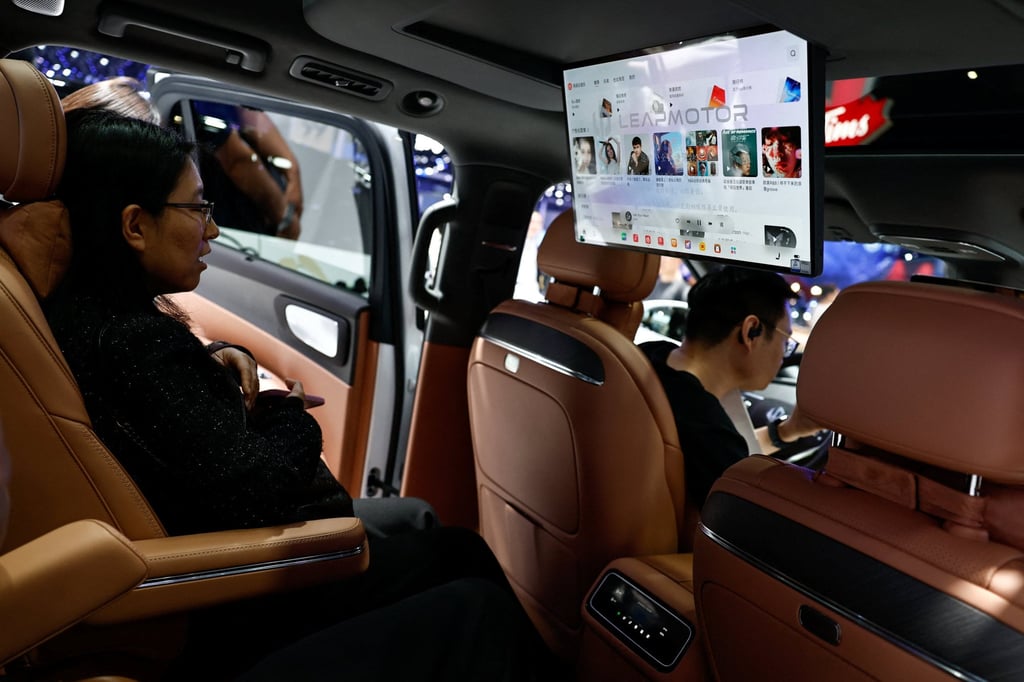 Visitors sit inside the Leapmotor D19 SUV during the Beijing International Automotive Exhibition (Auto China), in Beijing, April 24, 2026. Photo: Reuters