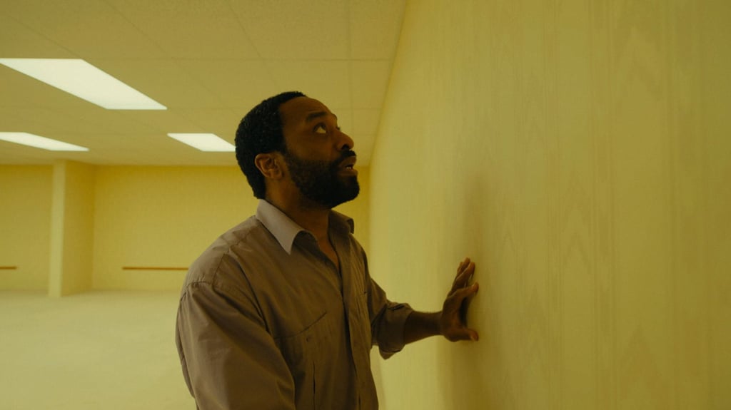 Chiwetel Ejiofor in Backrooms, contending with the liminal space’s signature yellow walls. Photo: TNS Chiwetel Ejiofor in Backrooms, contending with the liminal space’s signature yellow walls. Photo: TNS