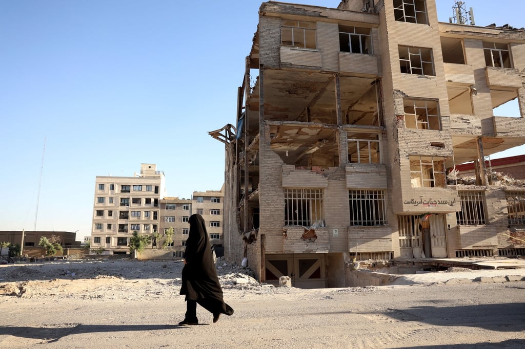 An Iranian woman walks past a residential building destroyed by previous US-Israeli strikes, in Tehran on Tuesday. Photo: EPA An Iranian woman walks past a residential building destroyed by previous US-Israeli strikes, in Tehran on Tuesday. Photo: EPA