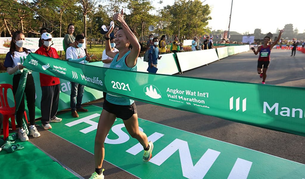 Hongkonger Elaine Lee crosses the finish line to win the women’s Angkor Wat half marathon in Siem Reap in 2021. Photo: Elaine Lee / SuSu Hongkonger Elaine Lee crosses the finish line to win the women’s Angkor Wat half marathon in Siem Reap in 2021. Photo: Elaine Lee / SuSu
