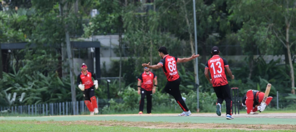 Hassan Khan Mohammad embarks on a celebratory run after claiming a wicket. Photo: Handout