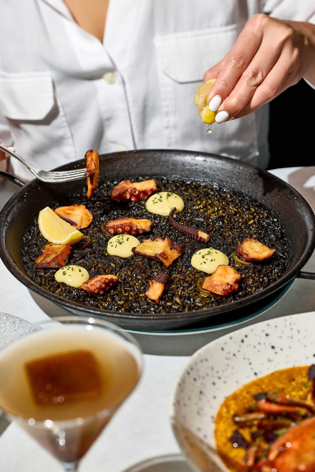 Squid-ink paella with octopus and aioli at Quiero Más. Photo: courtesy Quiero Más