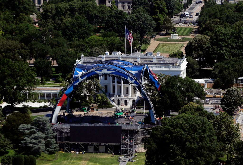 Workers continue building the cage for a future UFC fight on the South Lawn of the White House on Wednesday. Photo: AP
